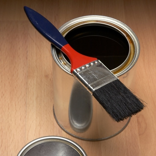 Can of polyurethane and a brush