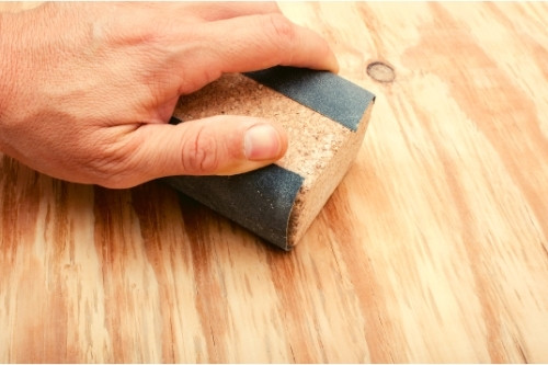 Sandpaper-wrapped-around-a-sanding-block